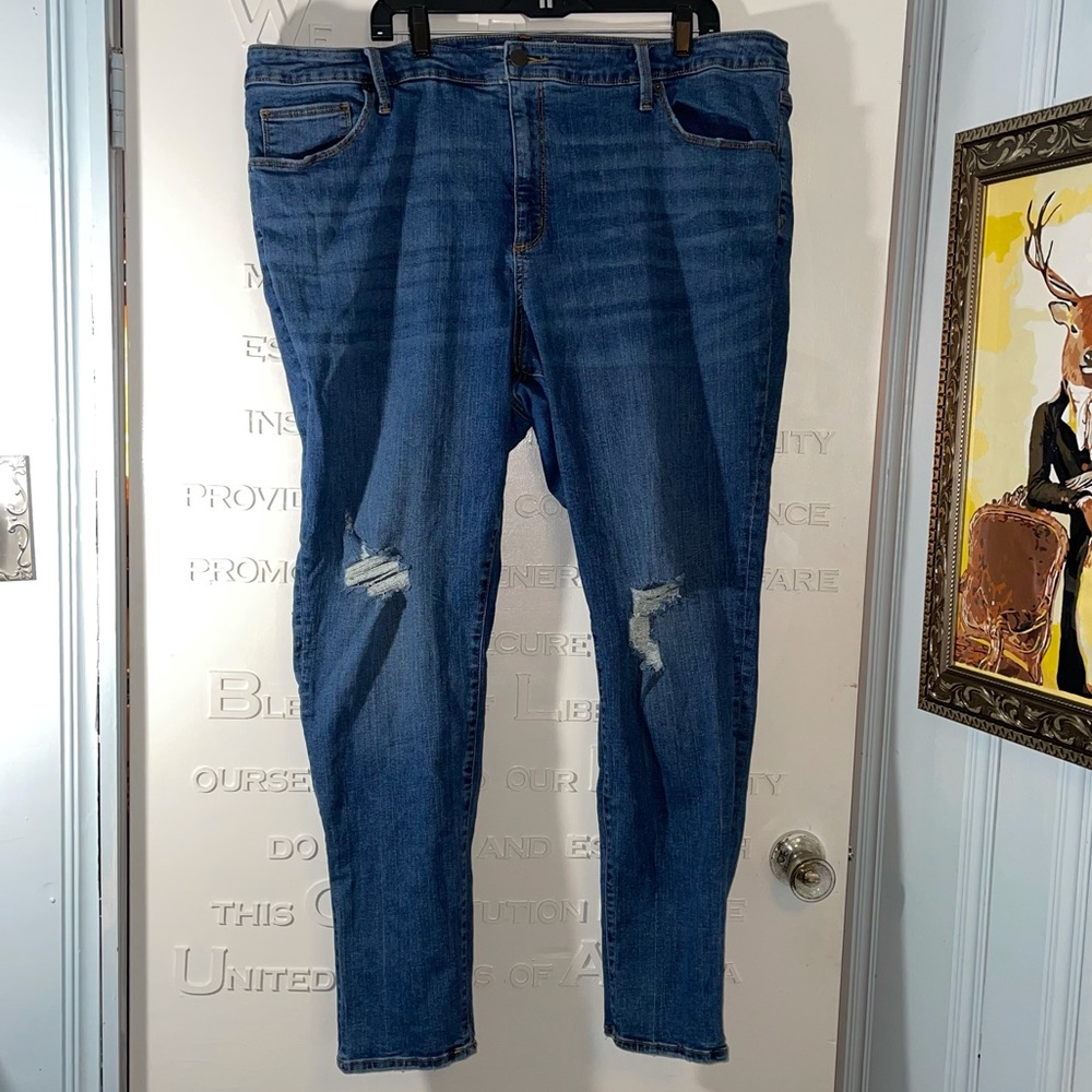 Distressed medium wash skinny jeans - size 24